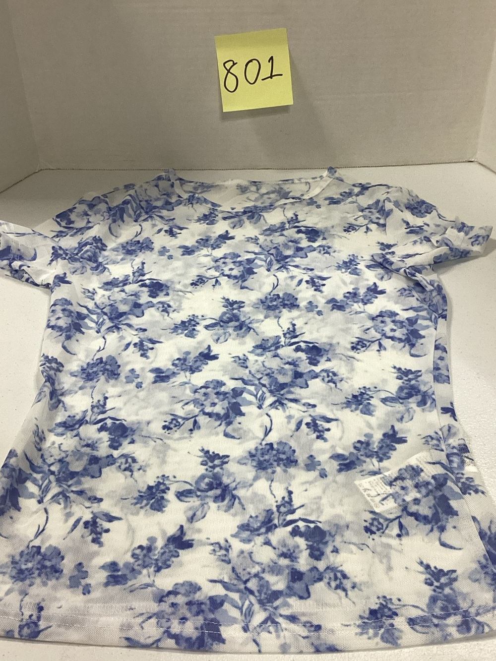 SHEIN White Tee with Blue Floral Pattern
Mesh